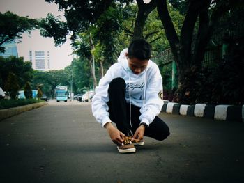 Full length of man on road in city