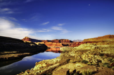 Scenic view of rock formations against cloudy sky