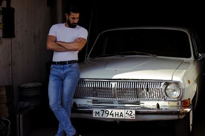 Man standing in car