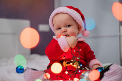 Portrait of cute girl playing with toy