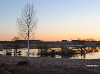 Scenic view of sea against clear sky during sunset