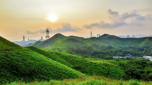 Scenic view of landscape against cloudy sky