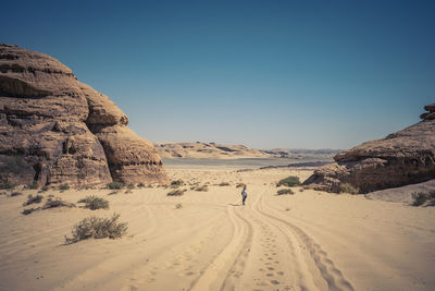 Scenic view of desert against clear sky