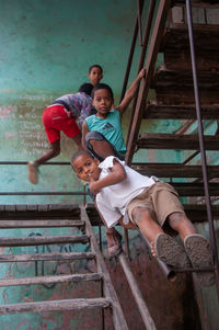 Low angle view of boy on staircase