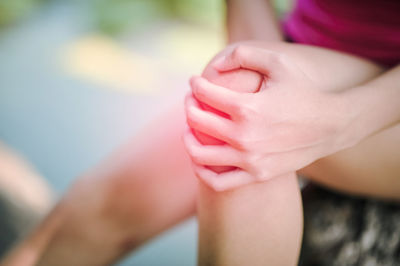 Close-up of with knee pain