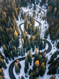 Aerial view of winding asphalt road in dolomities,italy. winter,autumn season