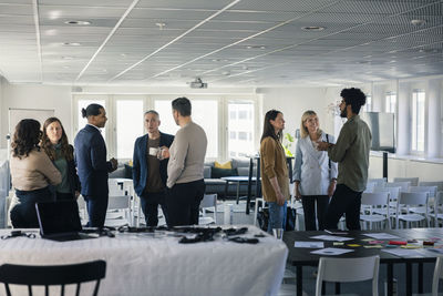 Business people having break during conference