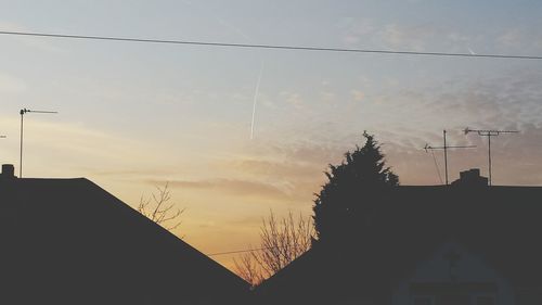 Low angle view of building against sky at sunset