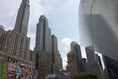 Low angle view of buildings in city against sky