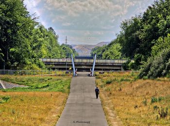 View of bridge against cloudy sky