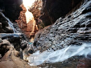 Stream flowing through rock formations