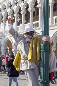 Full length of people standing in building