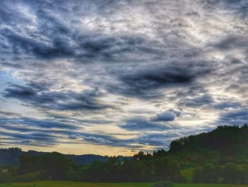 Scenic view of dramatic sky over landscape
