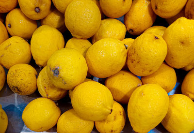 Full frame shot of lemon fruits for sale at market stall