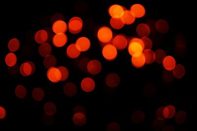 Defocused image of illuminated lights at night