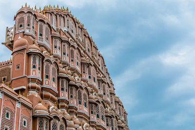 Low angle view of hawa mahal against blue sky