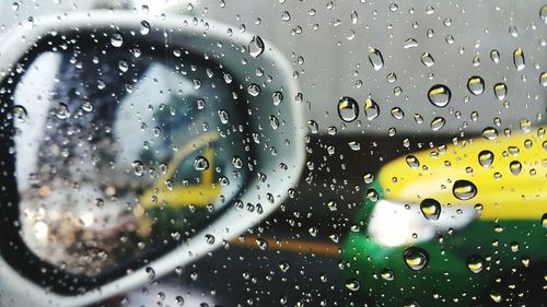 Close-up of raindrops on glass window