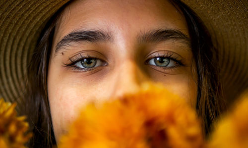 Portrait beautiful eyes girl face covered flowers