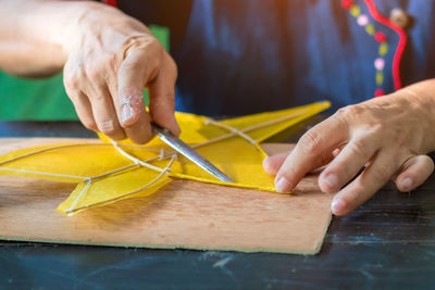 Close-up of man working on table