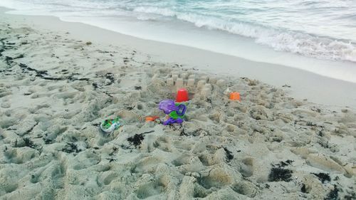 Toys on sand at beach