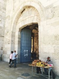 Full length of woman standing in corridor
