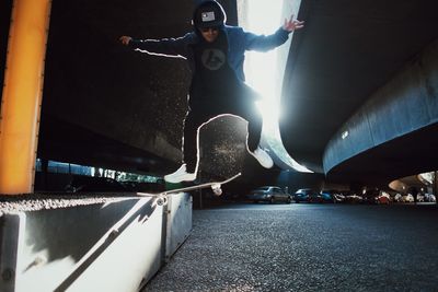 Low angle view of man jumping on skateboard