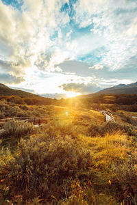 Scenic view of landscape against sky during sunset