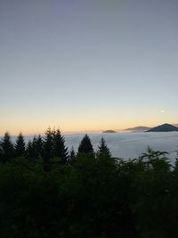 Scenic view of silhouette mountains against sky at sunset