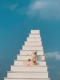 Digital composite image of a horse against blue sky