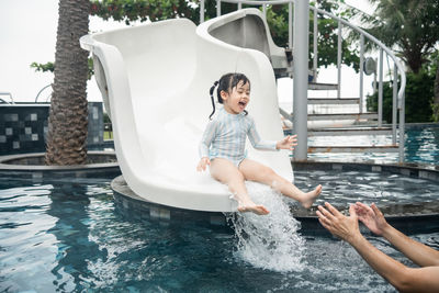 Rear view of woman in swimming pool