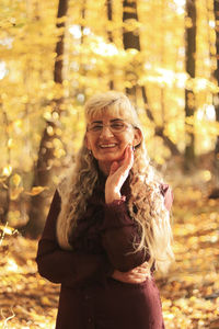 Portrait of a smiling young woman standing outdoors