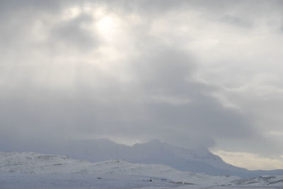 Scenic view of snow mountains against sky