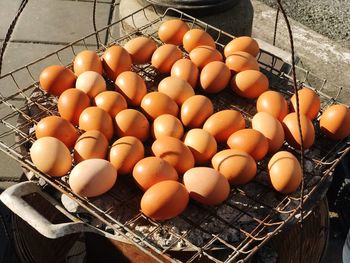 High angle view of eggs in metal basket