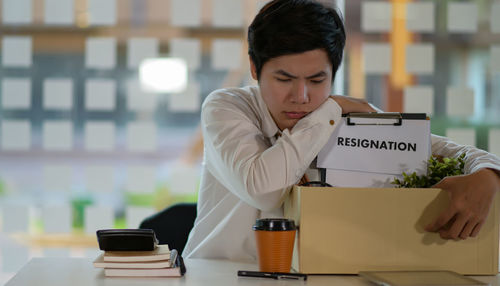 Young man working on table