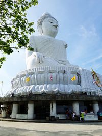 Low angle view of statue against sky