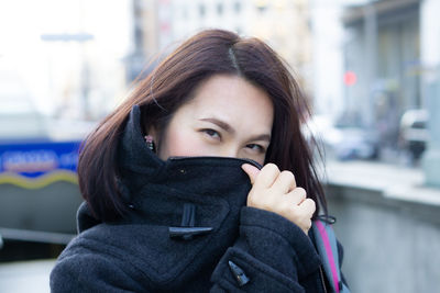 Portrait of beautiful woman in city