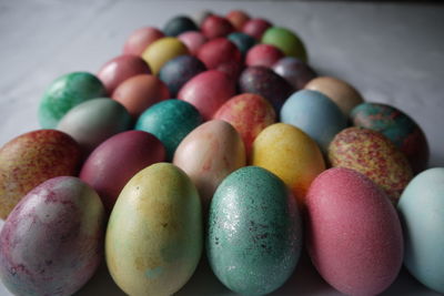 Close-up of multi colored eggs on table