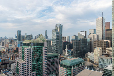 Modern buildings in city against sky