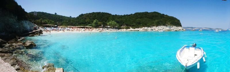 Panoramic view of sea against clear blue sky