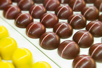 High angle view of candies in row