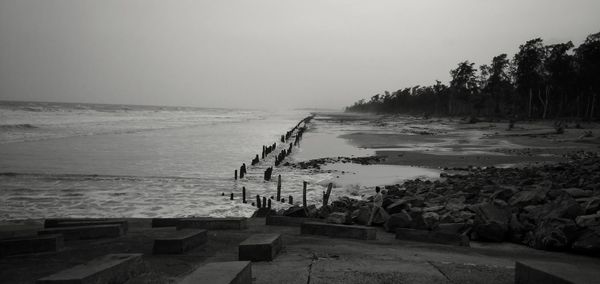 Scenic view of beach against clear sky
