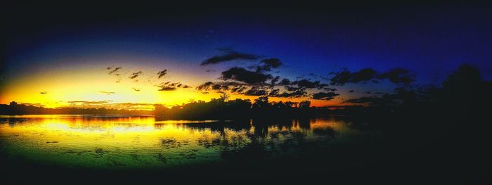 Scenic view of lake at sunset