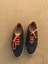 High angle view of shoes on beach