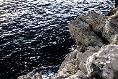 High angle view of rock in sea