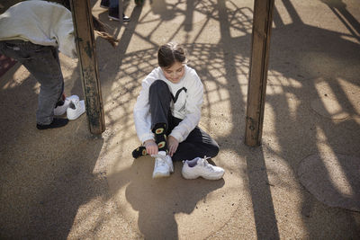 Girl sitting at playground