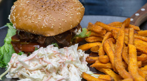 Close-up of burger and french fries on plate