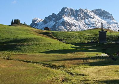 Countryside landscape against rocky mountains