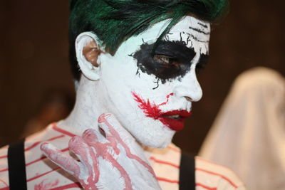Close-up of man with painted body during event