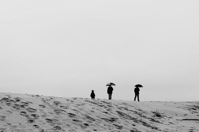 Man standing on snow covered landscape