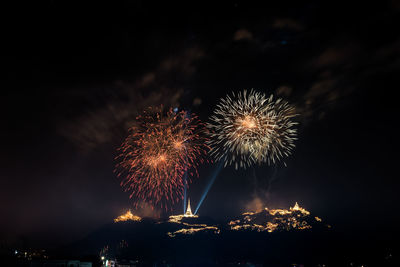 Firework display at night